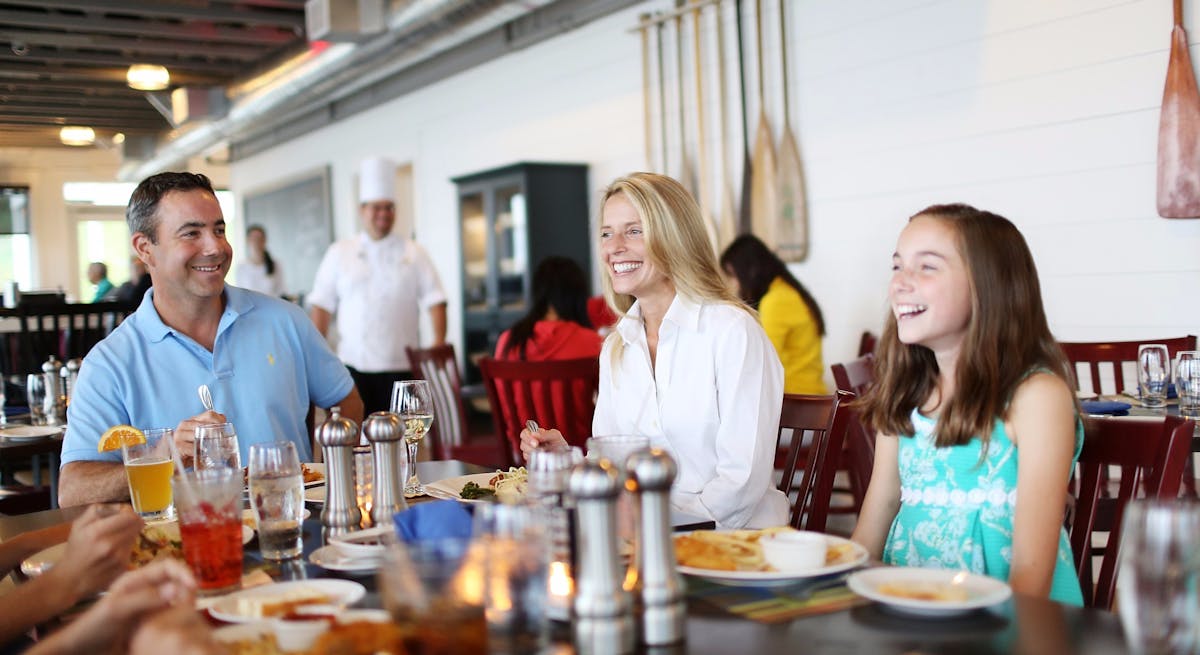 a group of people sitting at a table