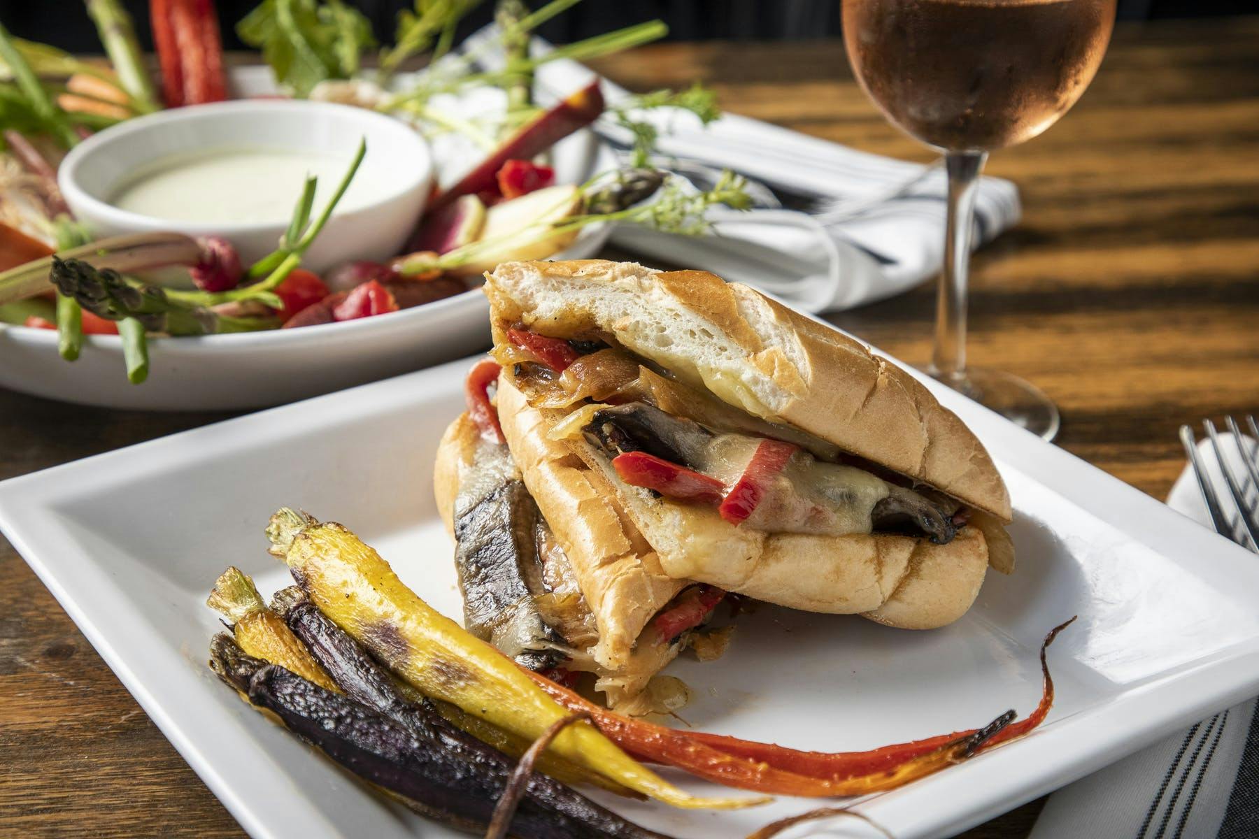 a close up of a plate of a sandwich on a table