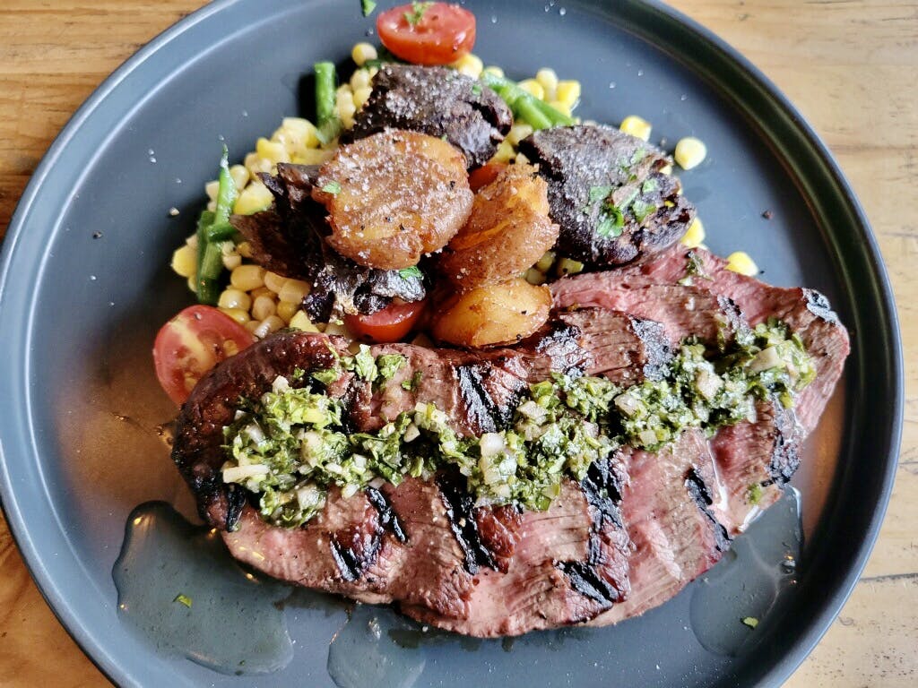 a steak with veggies