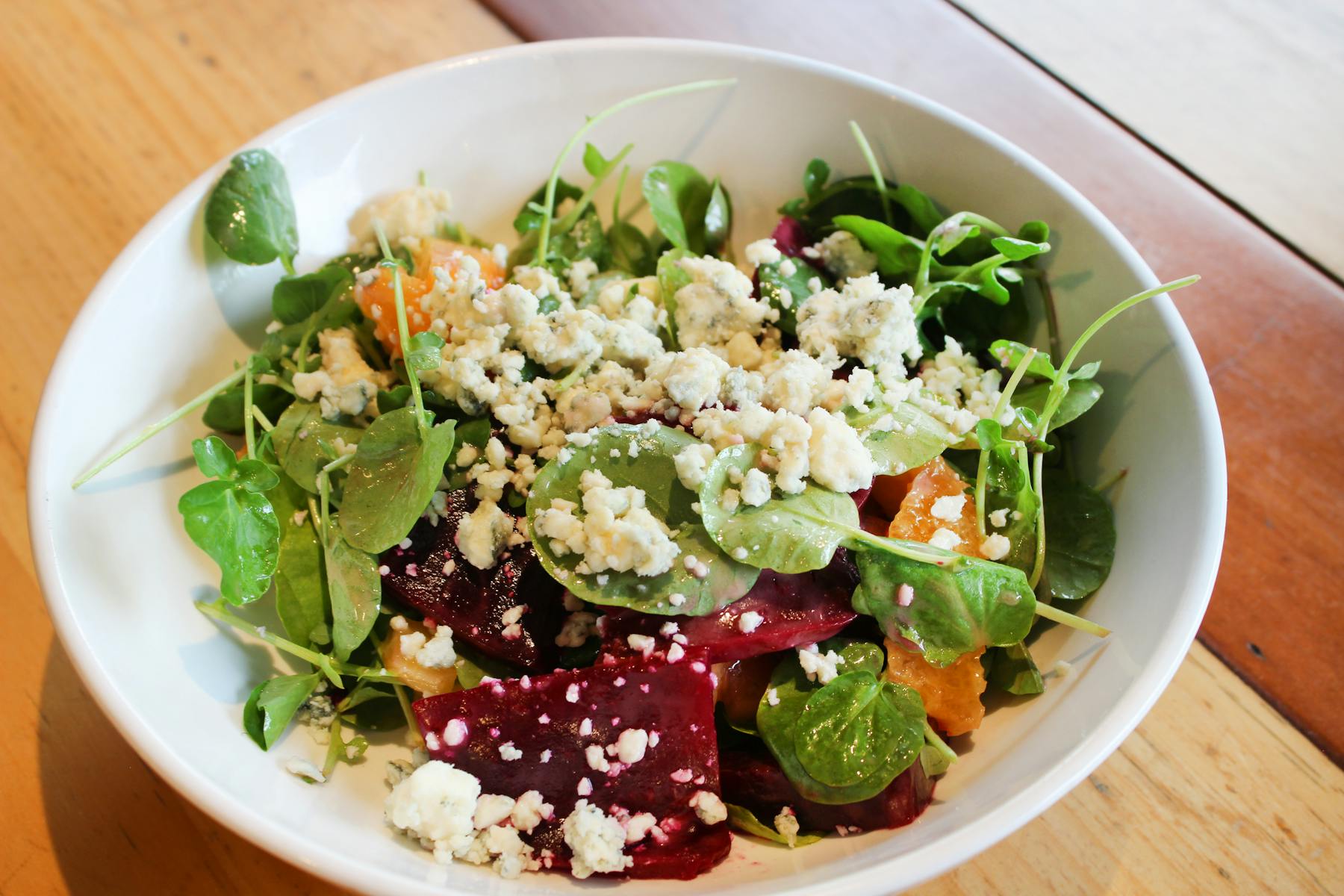 a bowl of salad on a plate