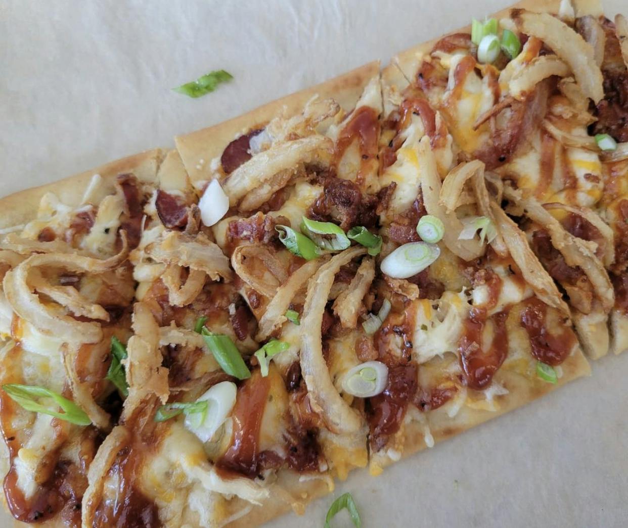 a close up of a piece of pizza