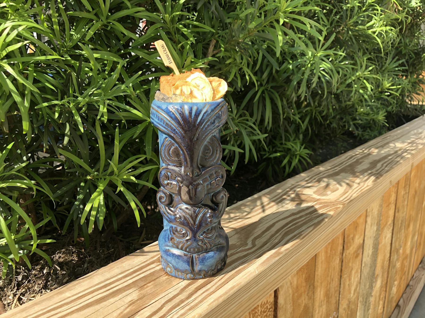 a vase of flowers sitting on top of a wooden table