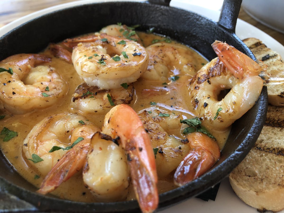 a cast-iron dish with shrimp