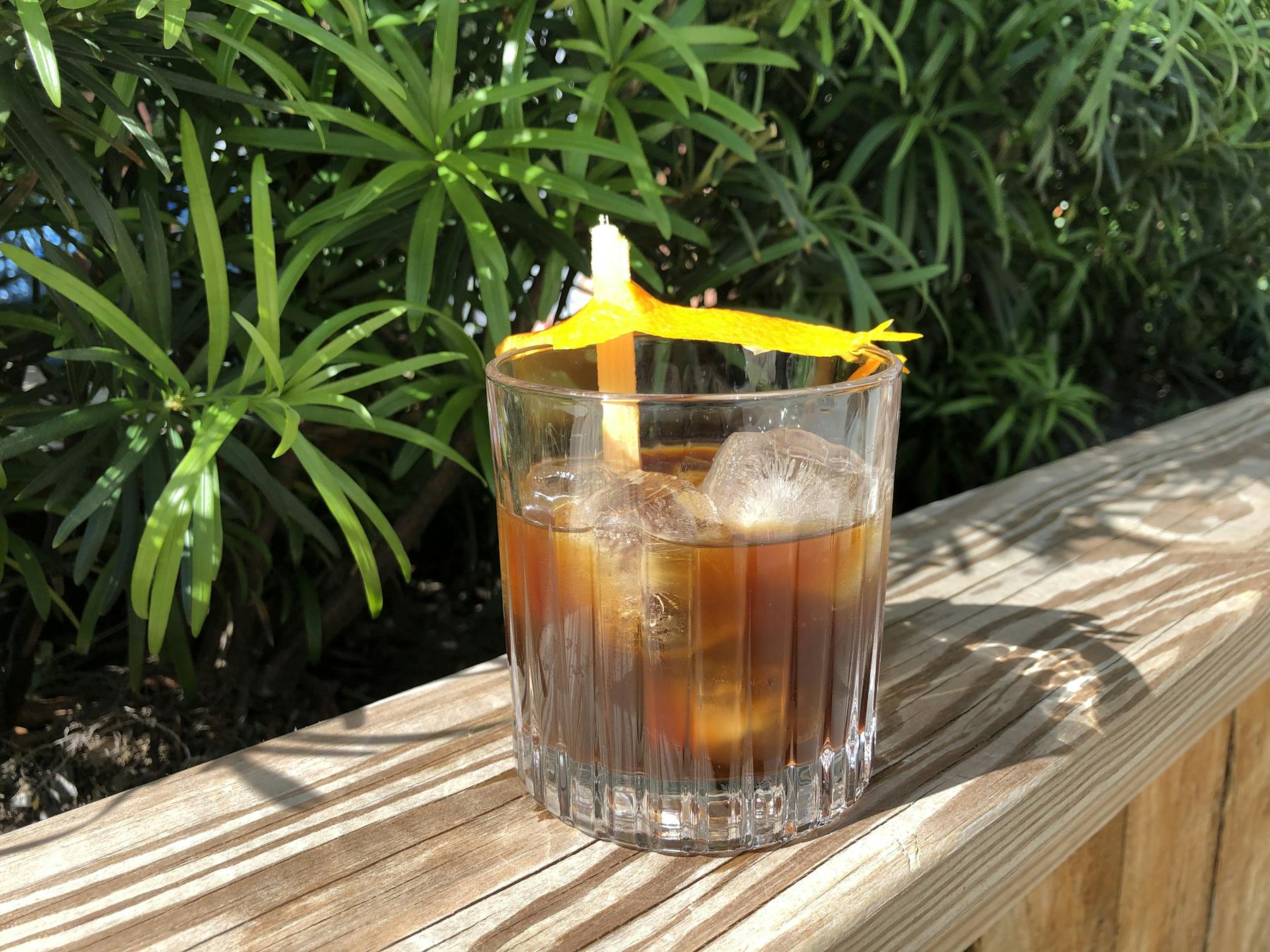 a glass of beer on a plant