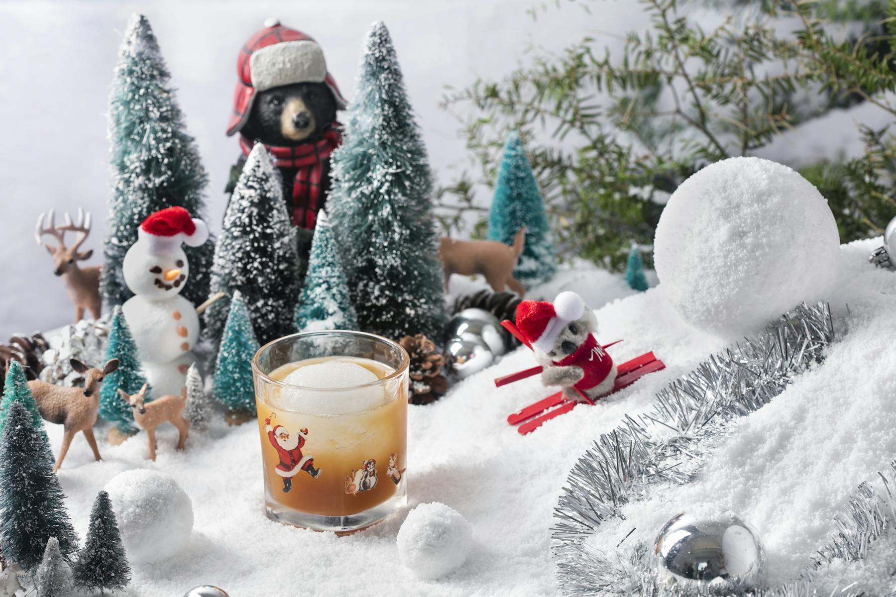 a group of stuffed animals that are in the snow