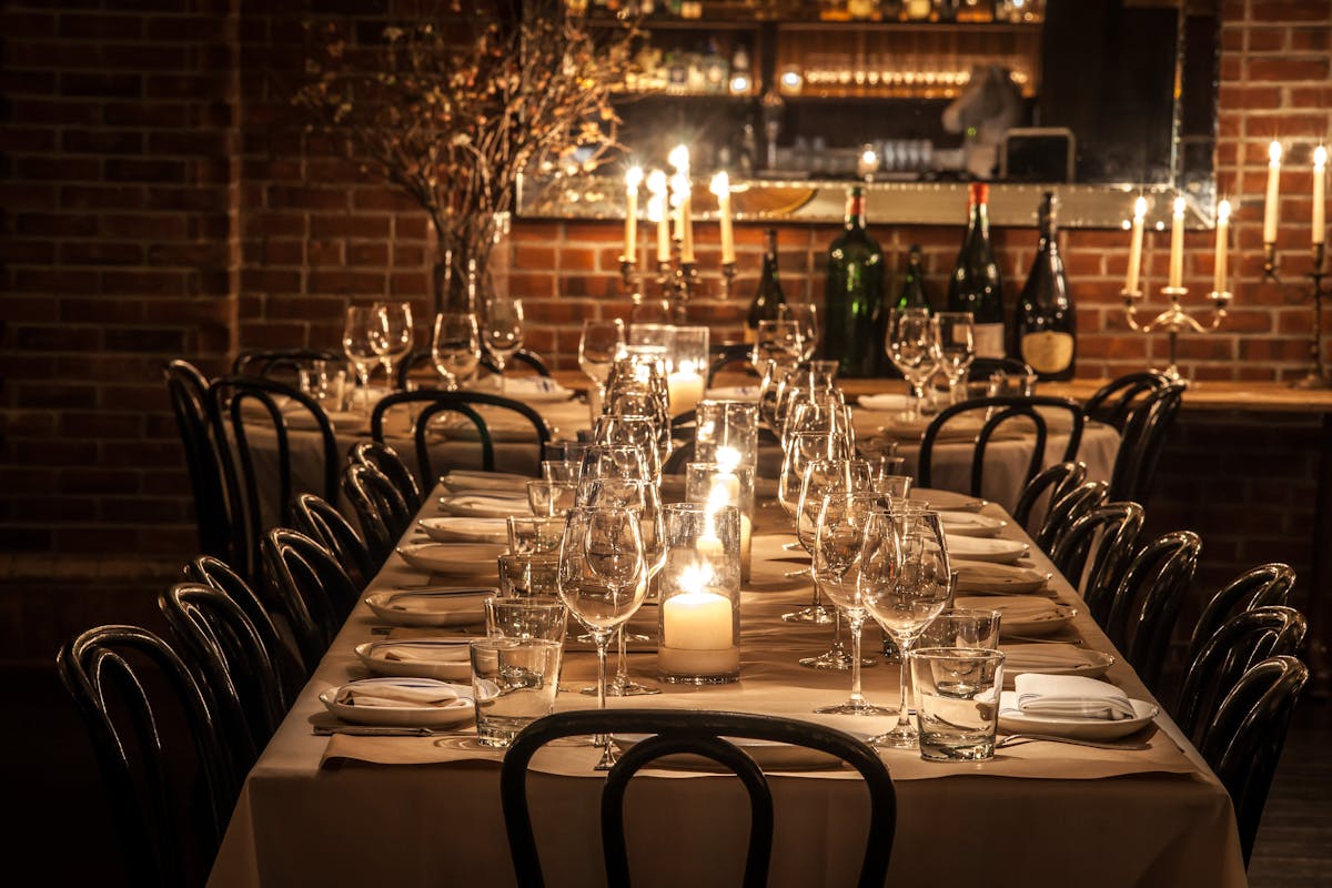 a row of wine glasses on a table