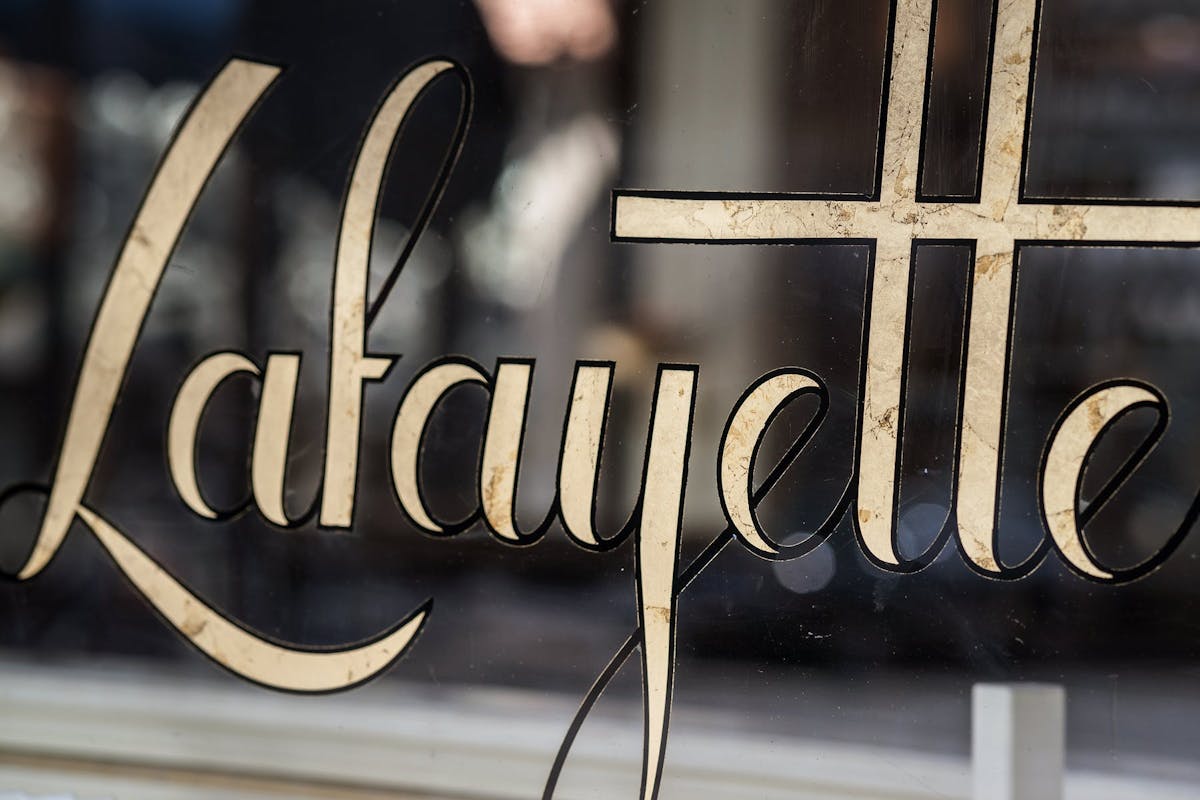a close up of a window with the logo on top
