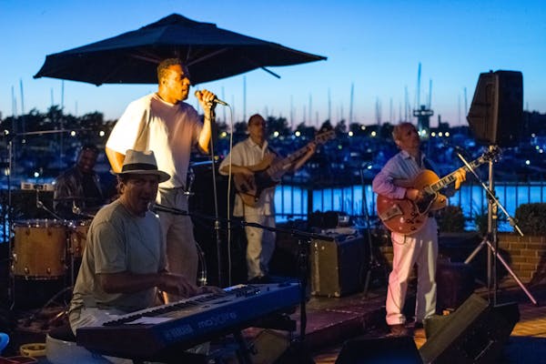 a group of people standing on a boat