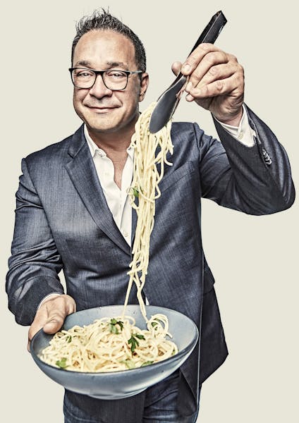 a man holding a plate of food