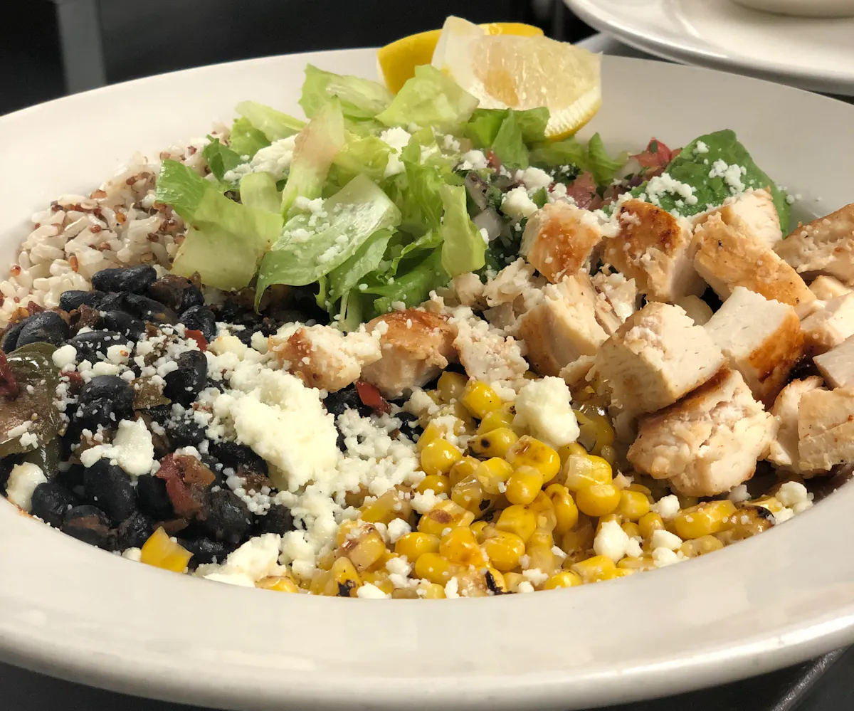a plate of food with rice and vegetables