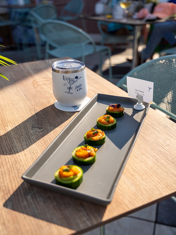 a tray of food on a wooden table