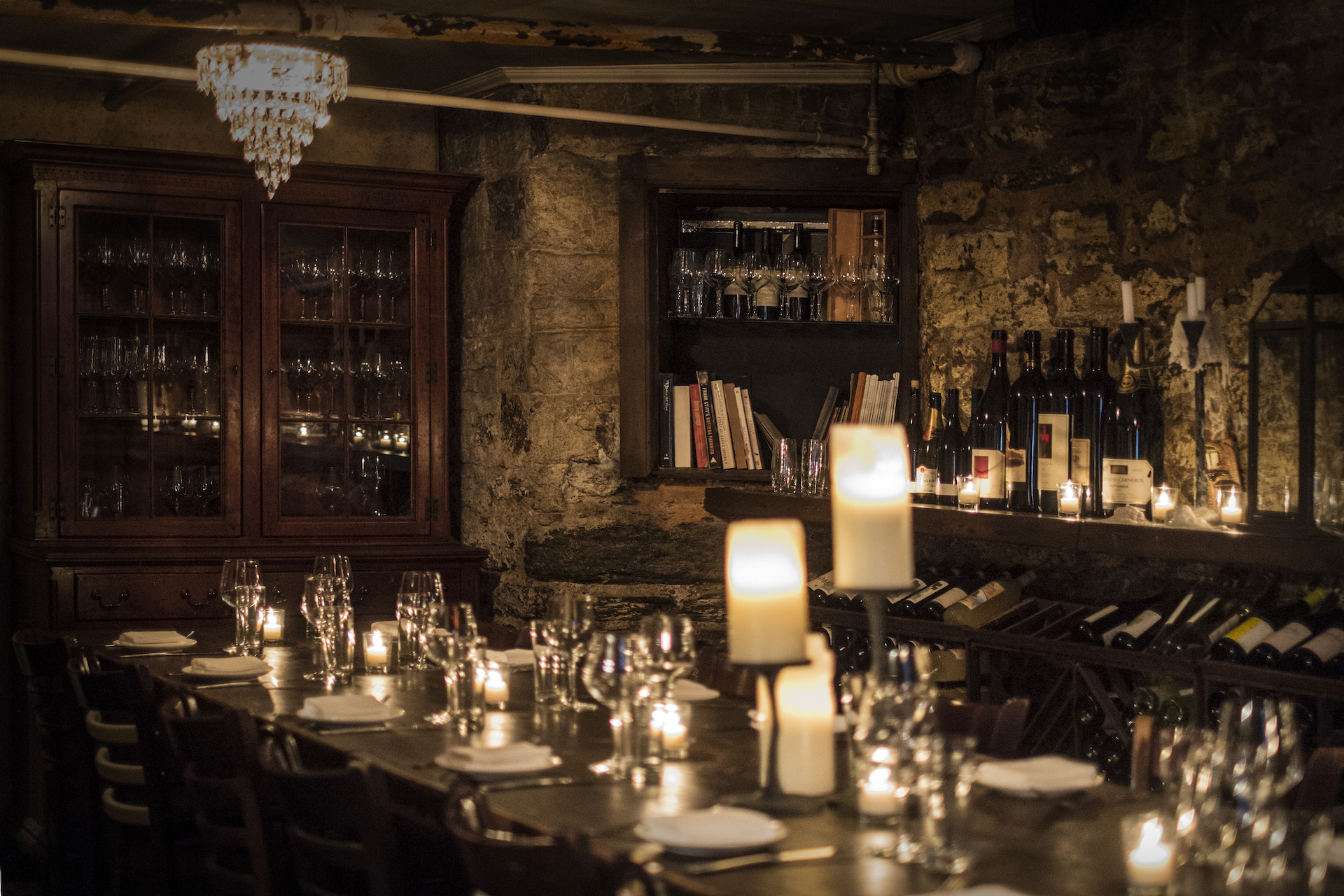 a dining room table filled with wine glasses