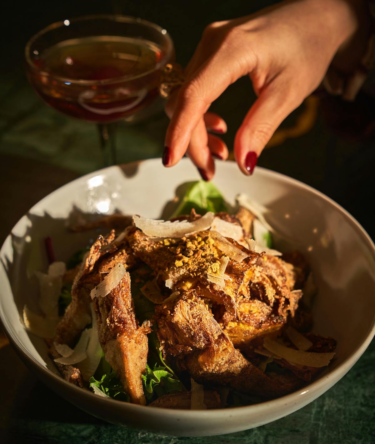 a person holding a plate of food