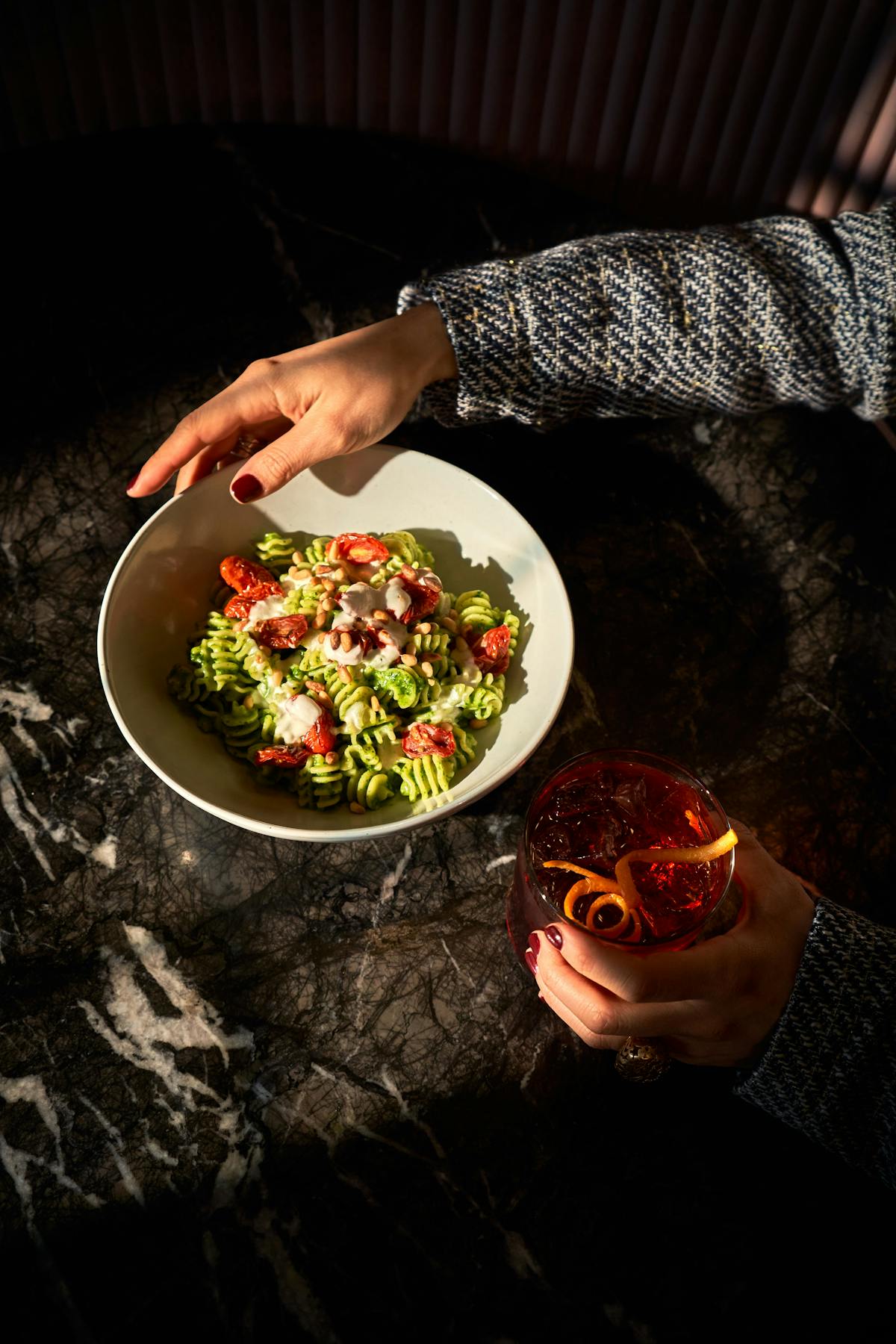 a person holding a bowl of food