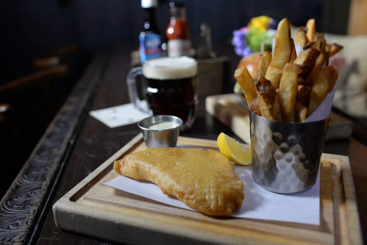 a close up of food on a table next to a cup of coffee
