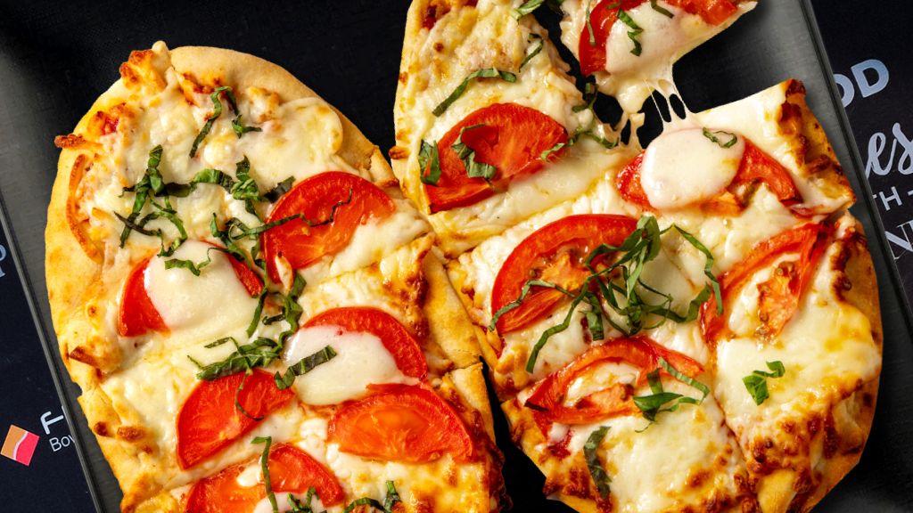 a pizza with tomatoes and cheese