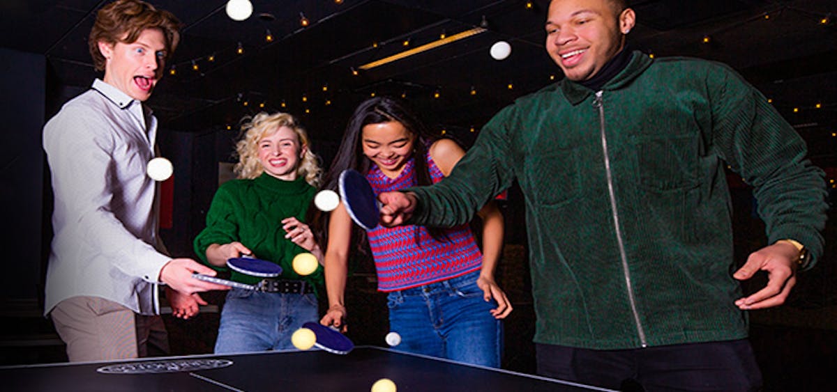 a group of people standing in a room