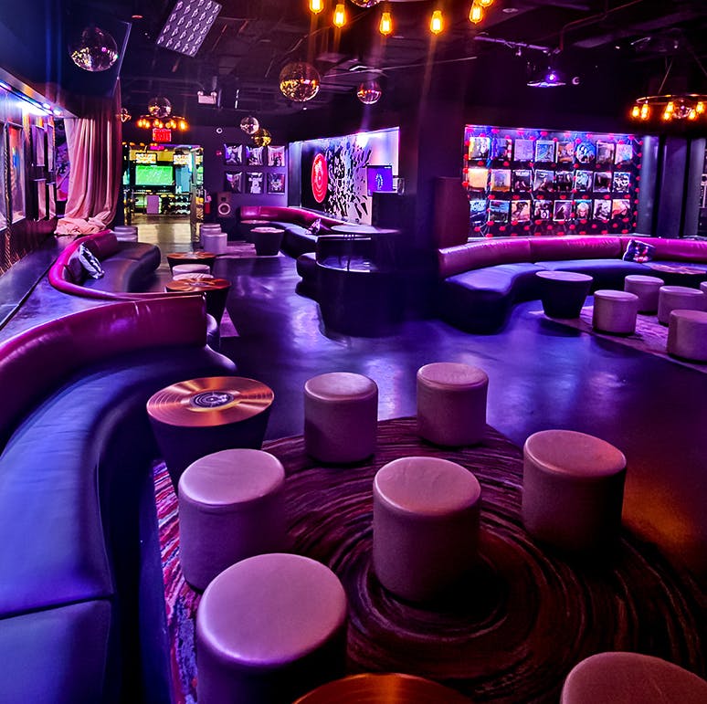 a group of people sitting in a chair talking on a cell phone