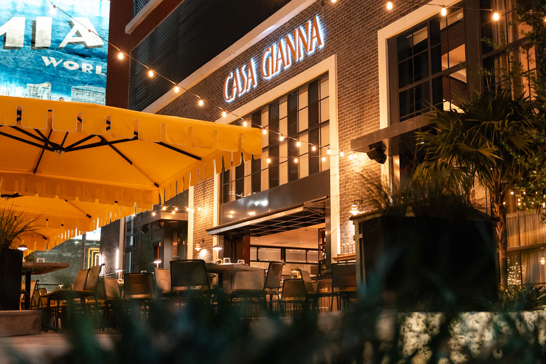 Outdoor dinner on Casa Gianna's Terrazza at night in downtown Miami