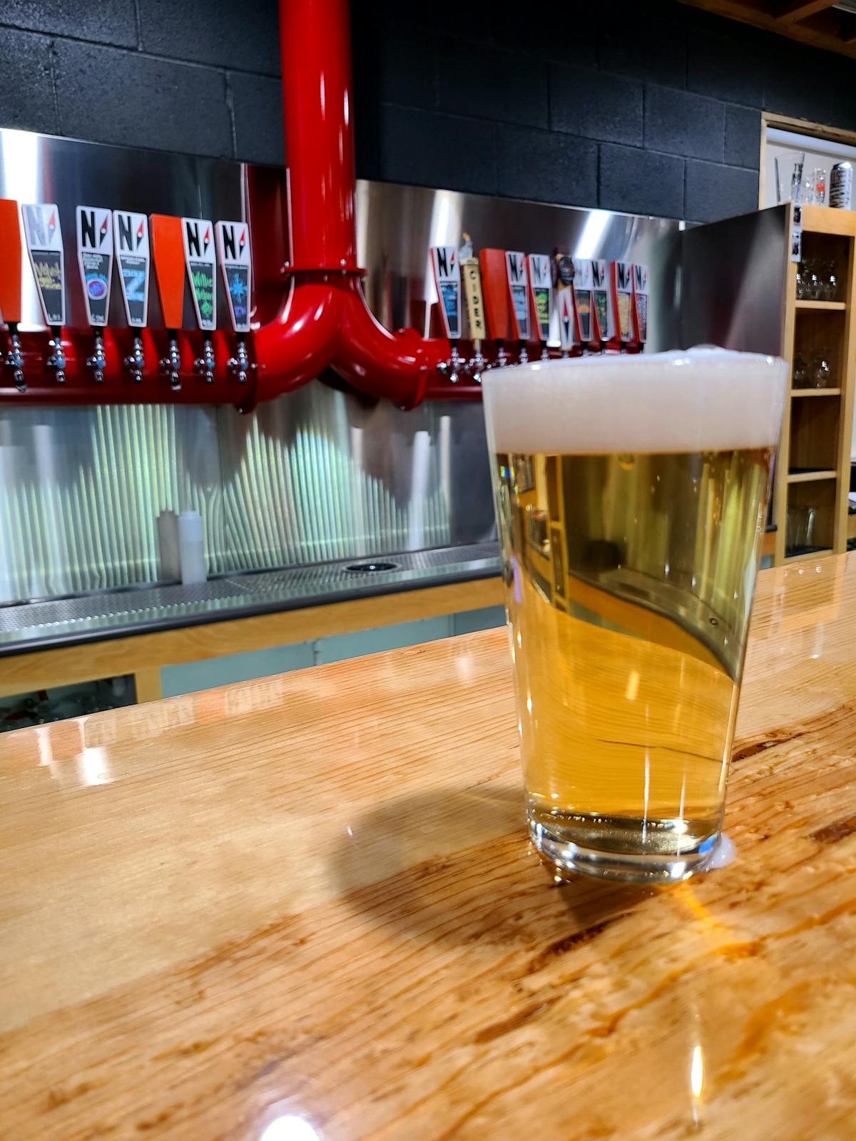 a glass of beer on a table
