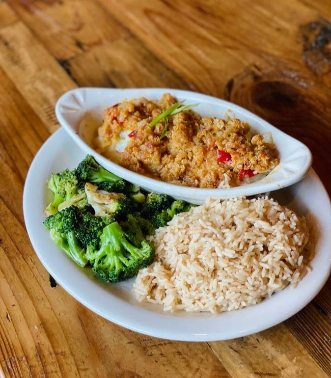 a plate of food with rice and broccoli