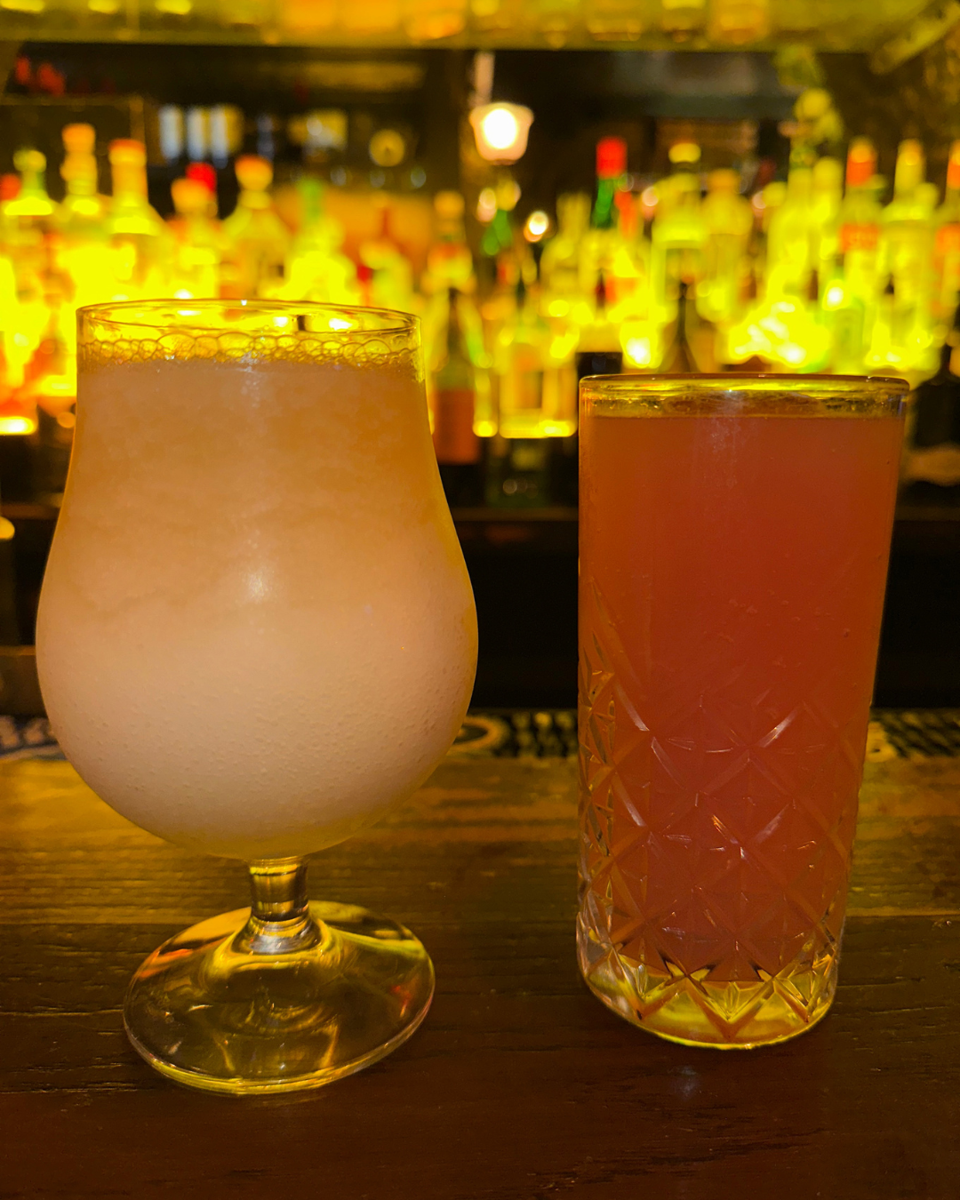 two frozen margaritas on the bar