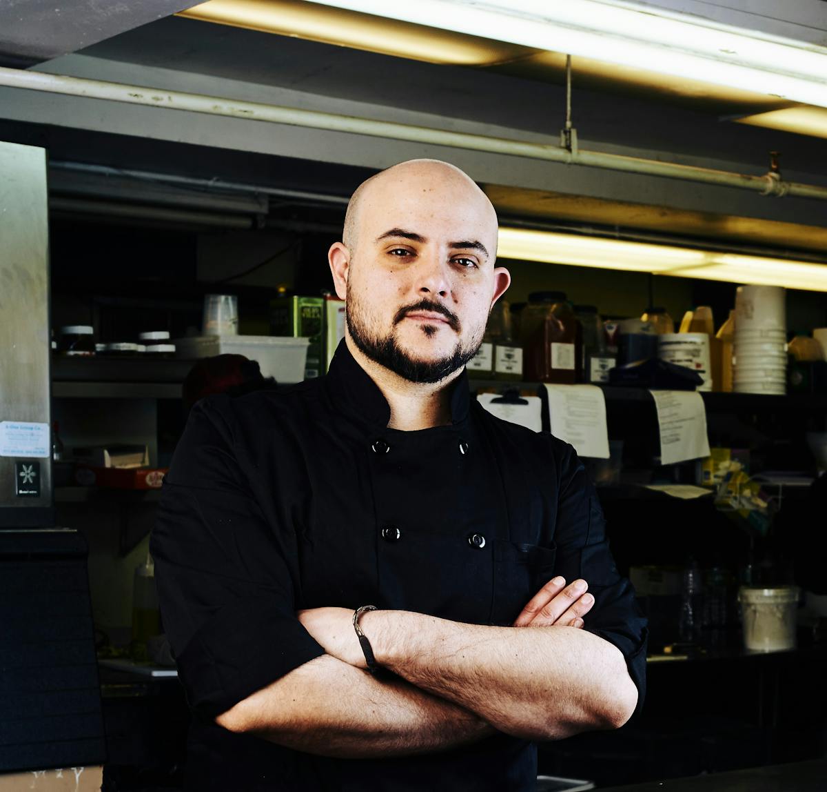 a man standing in front of a restaurant