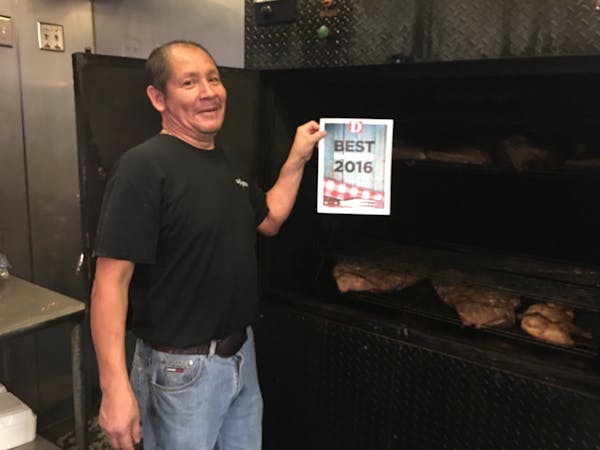 a man standing in front of a box