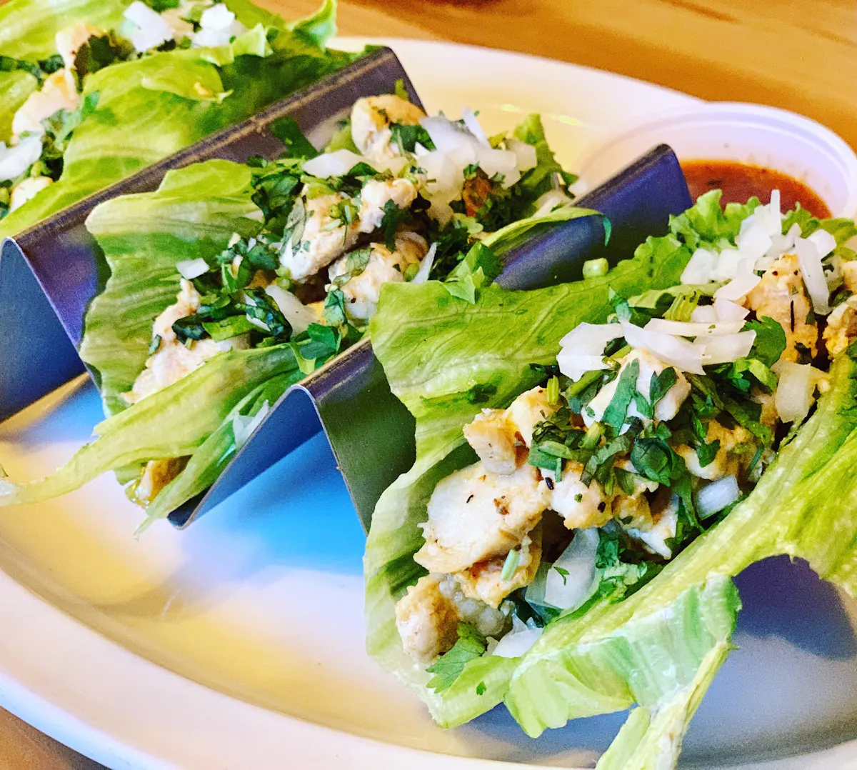 three lettuce street tacos on a plate