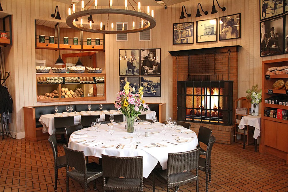 a person sitting at a table in a restaurant