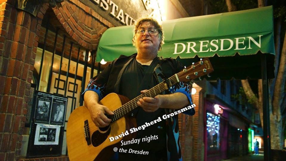 a man holding a guitar