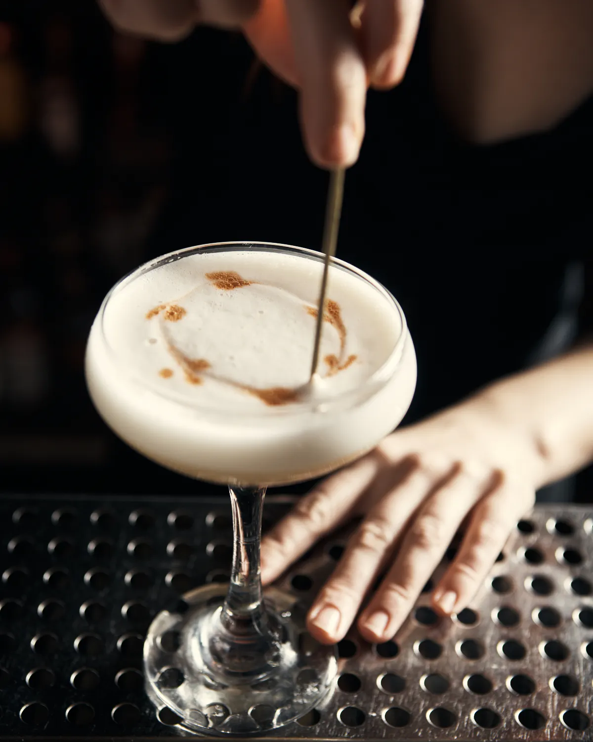 a person preparing a drink