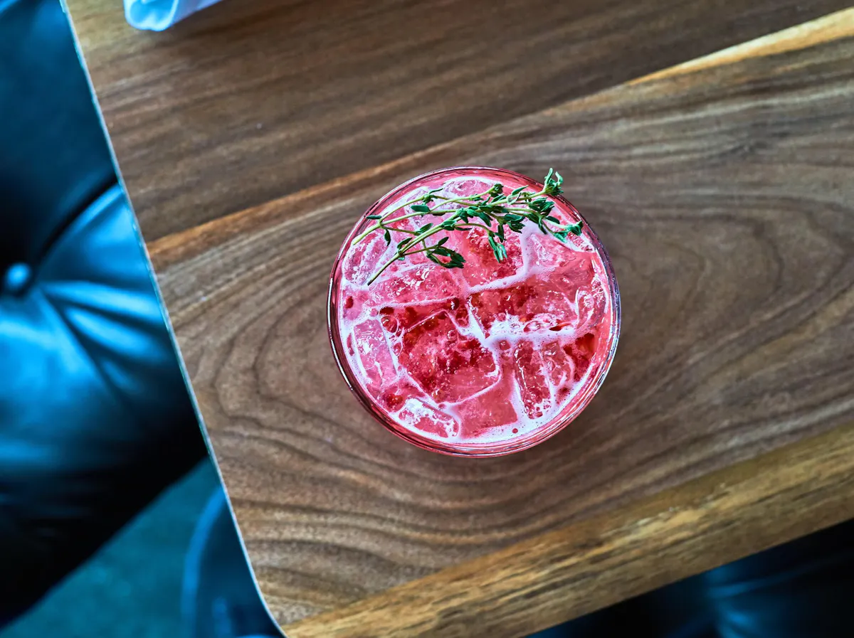 Close up of table with our Cocktail called So Much Drama on top 