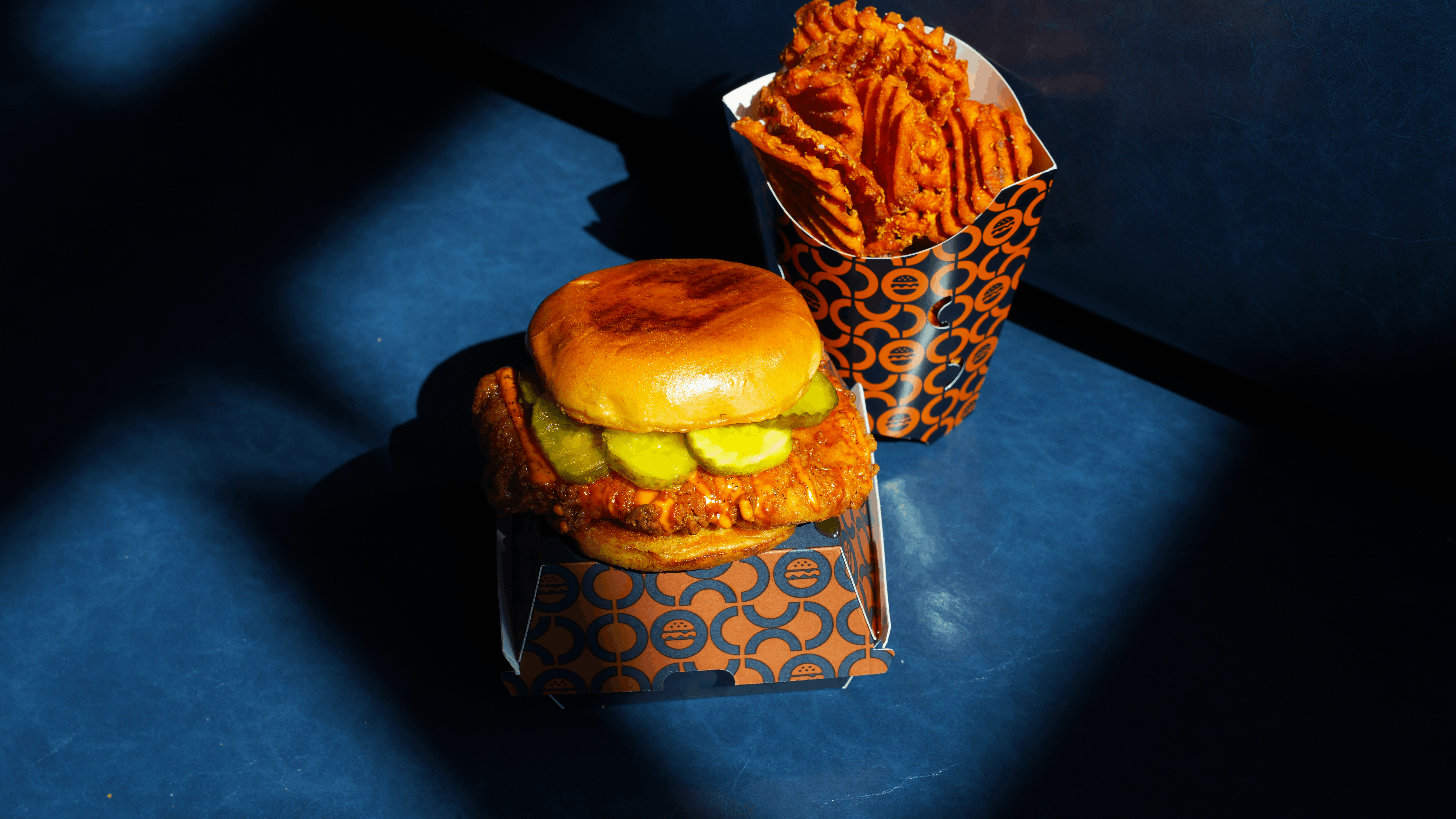 a burger and fries in a container