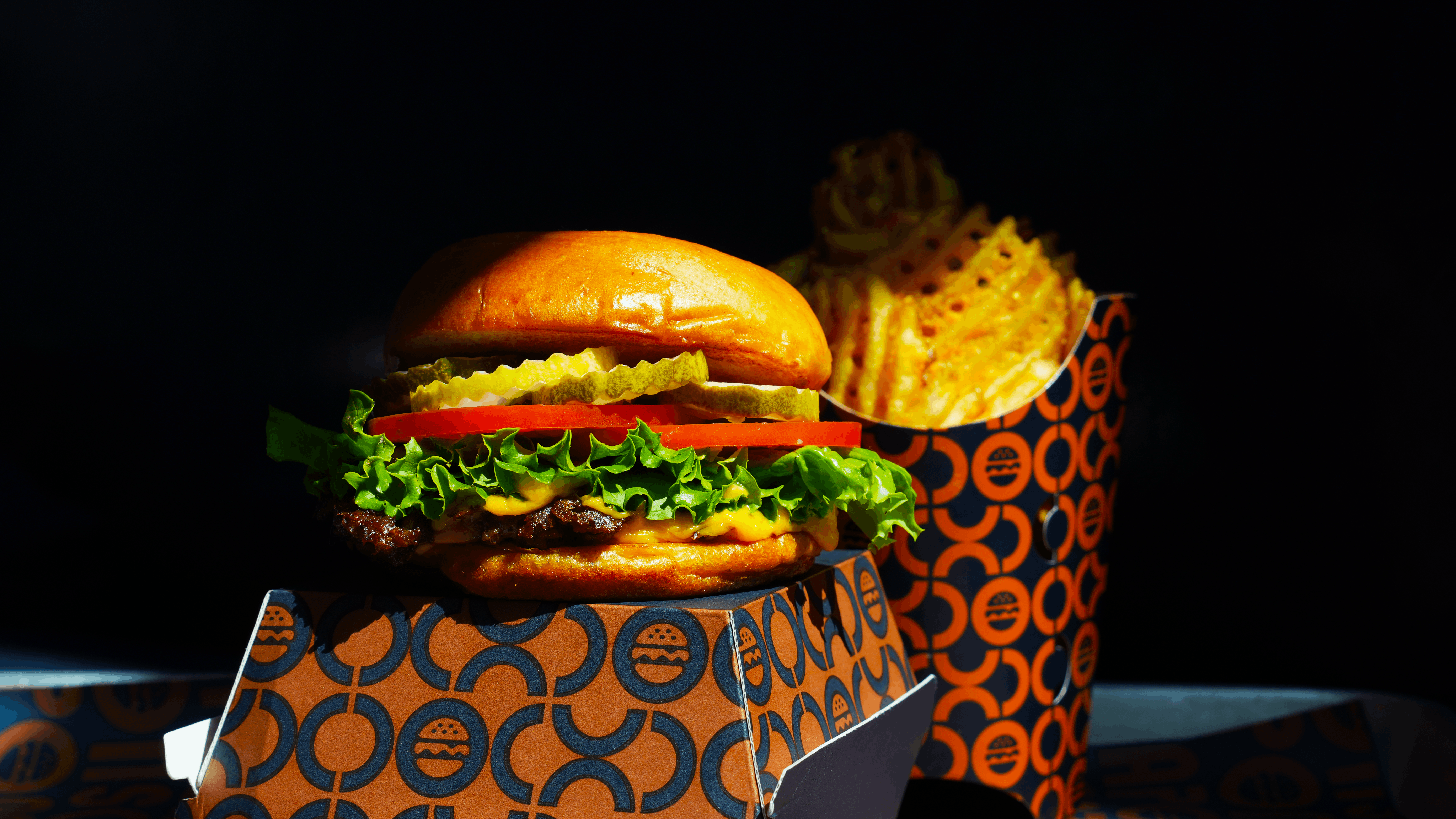 a burger and fries in a box