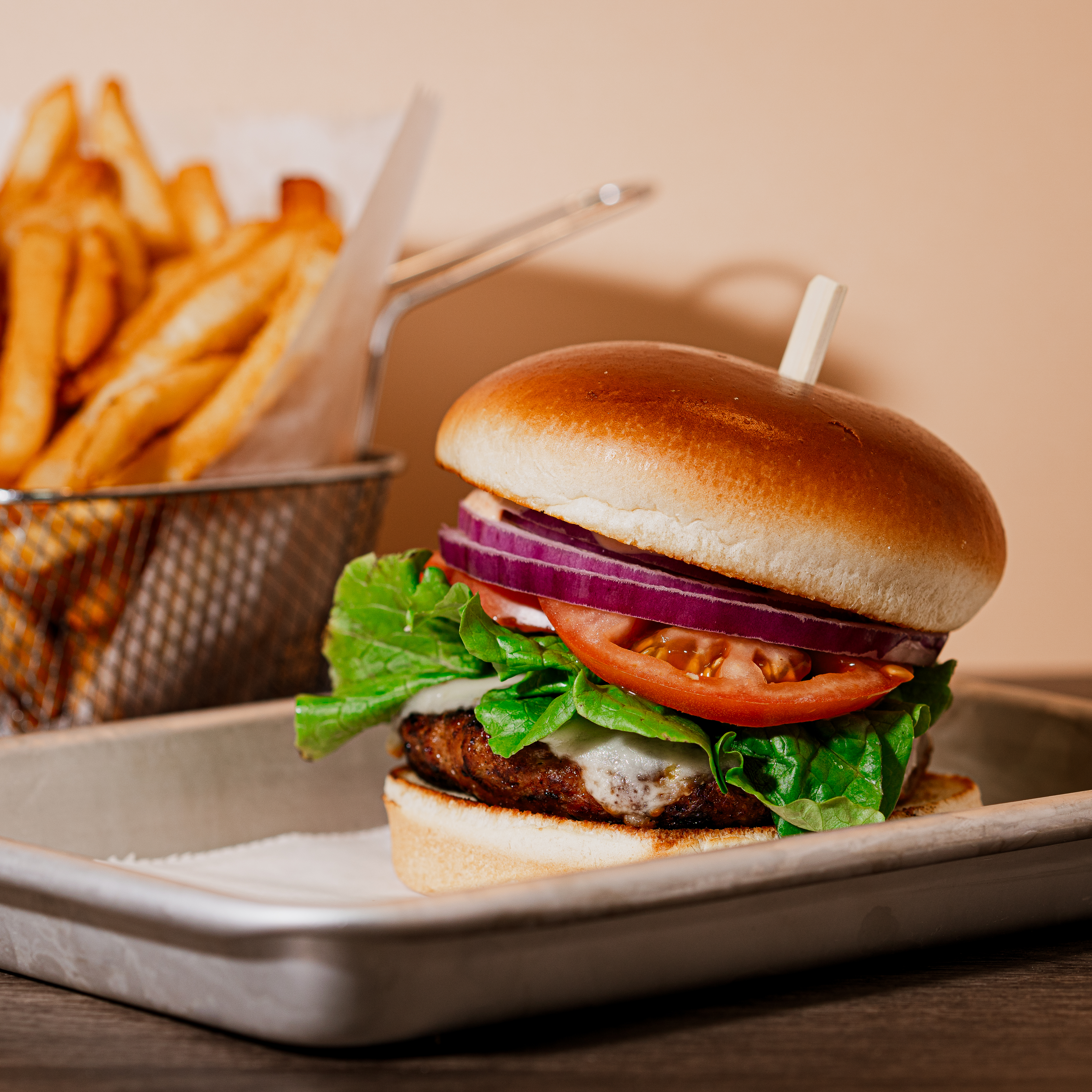 a sandwich with lettuce and fries on a plate