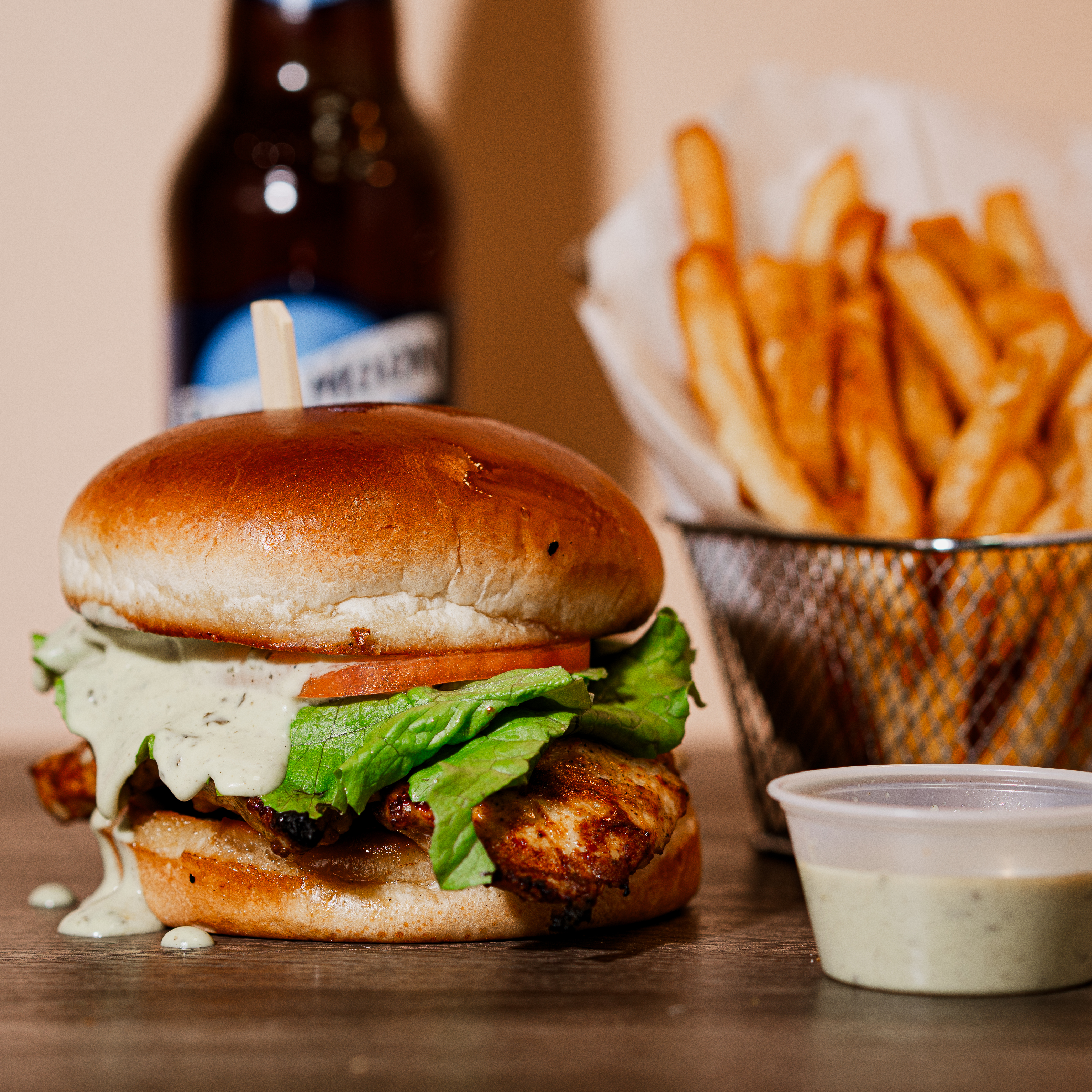 a plate of food with a sandwich and fries on a table