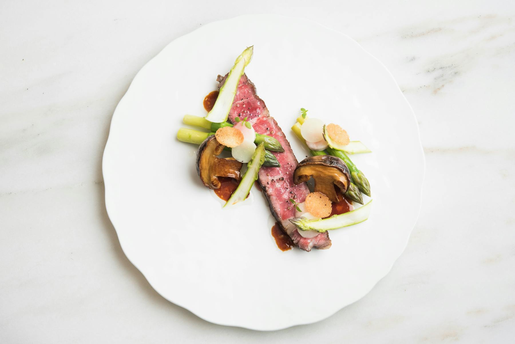a slice of meat and mushrooms