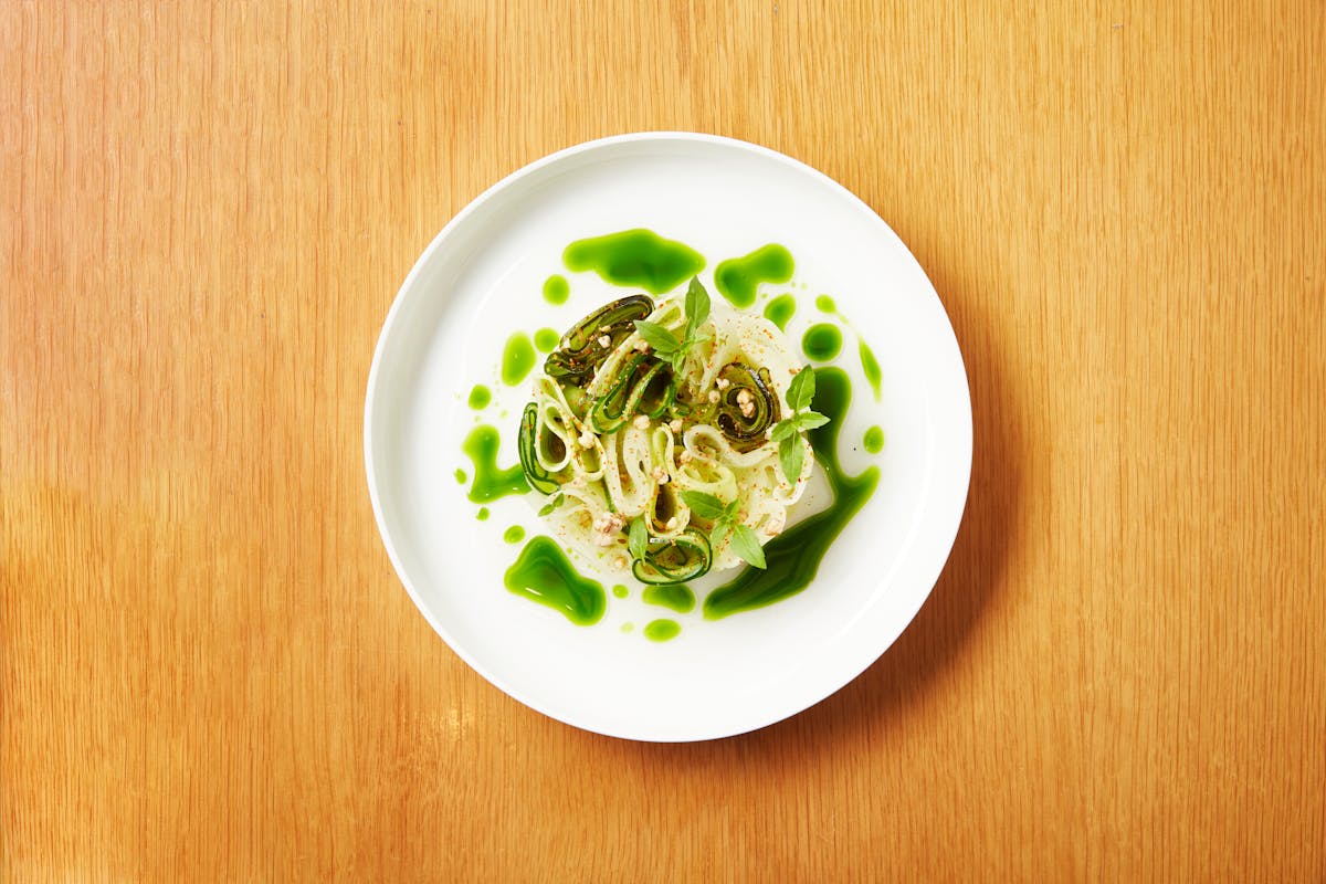 a plate of food sitting on top of a wooden table