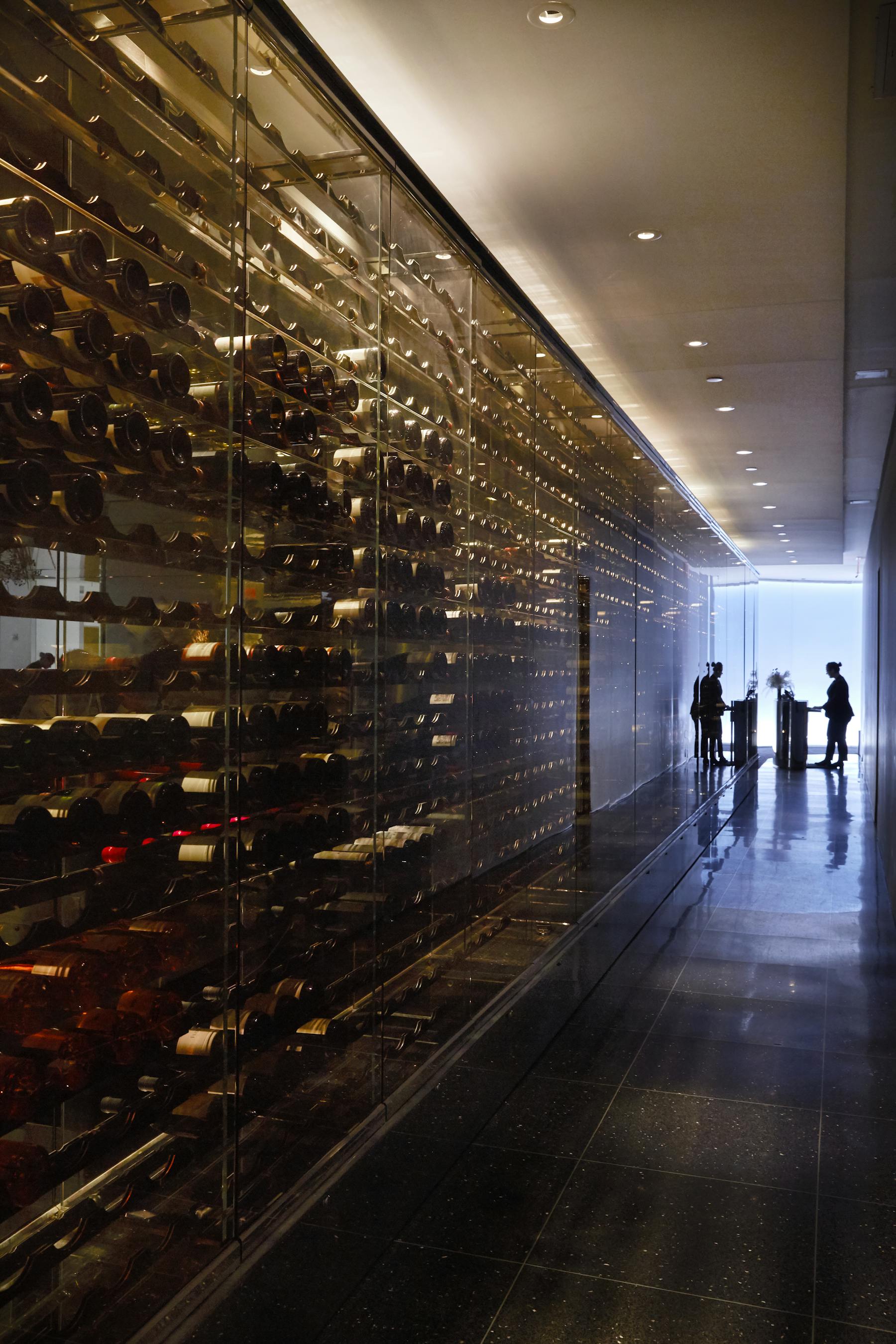 The wine wall entryway to The Modern, with a view towards the host stand