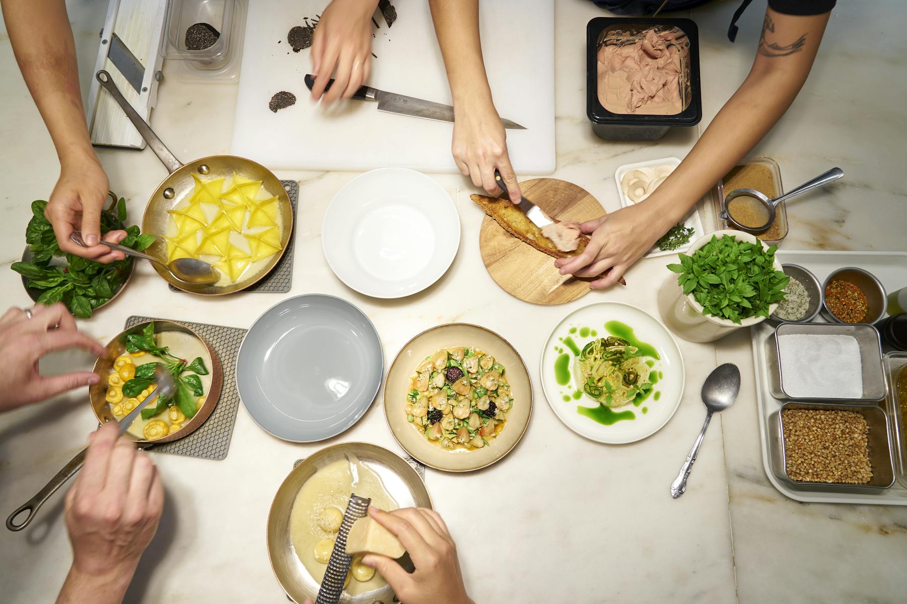 a group of people sitting at a table with a plate of food
