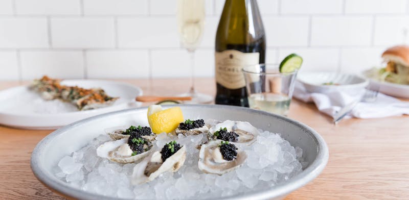 a plate of oysters on a table