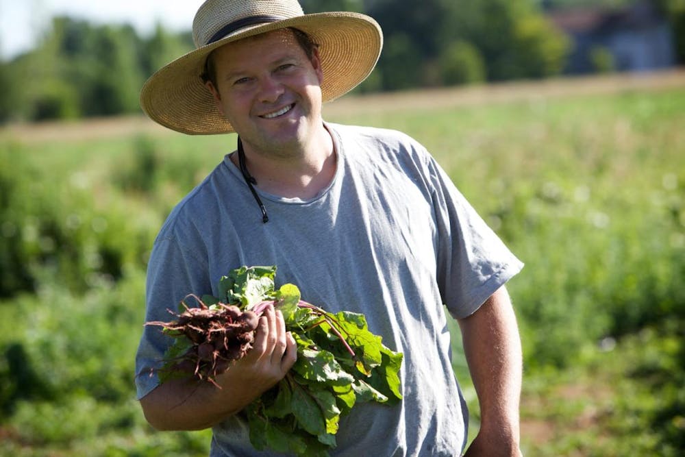 a man in a green hat