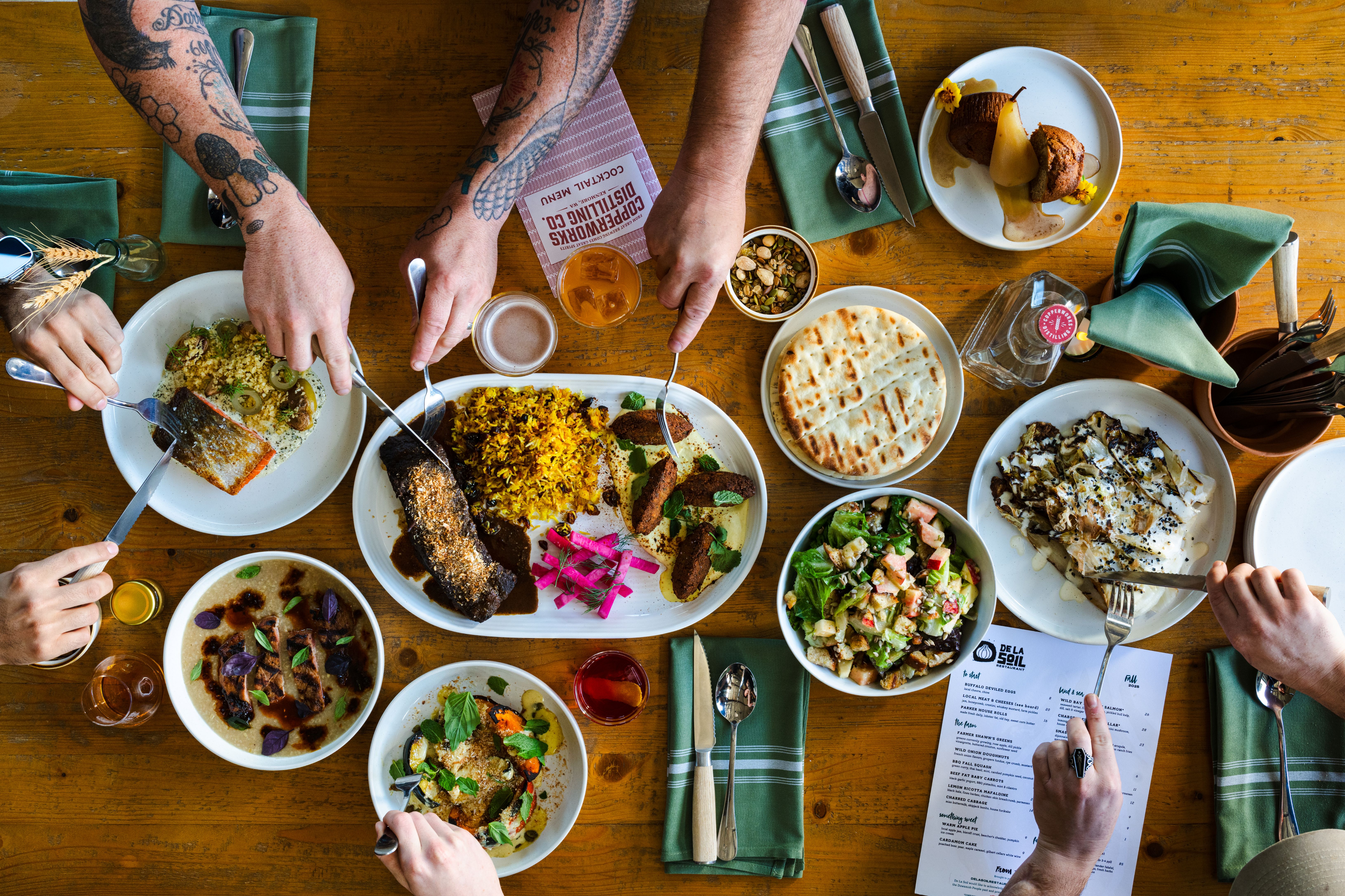 a group of people eating food on a table