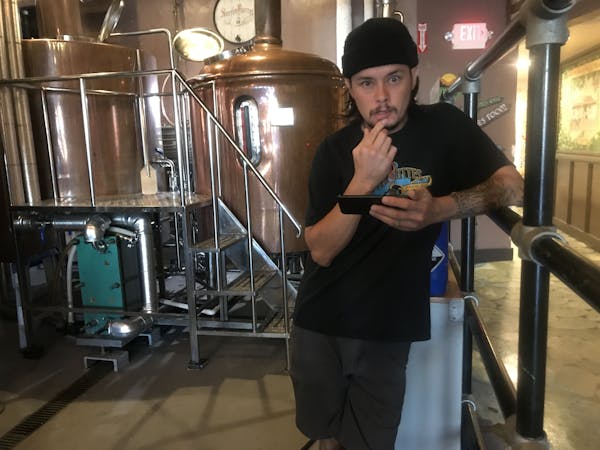 a man that is standing in the kitchen