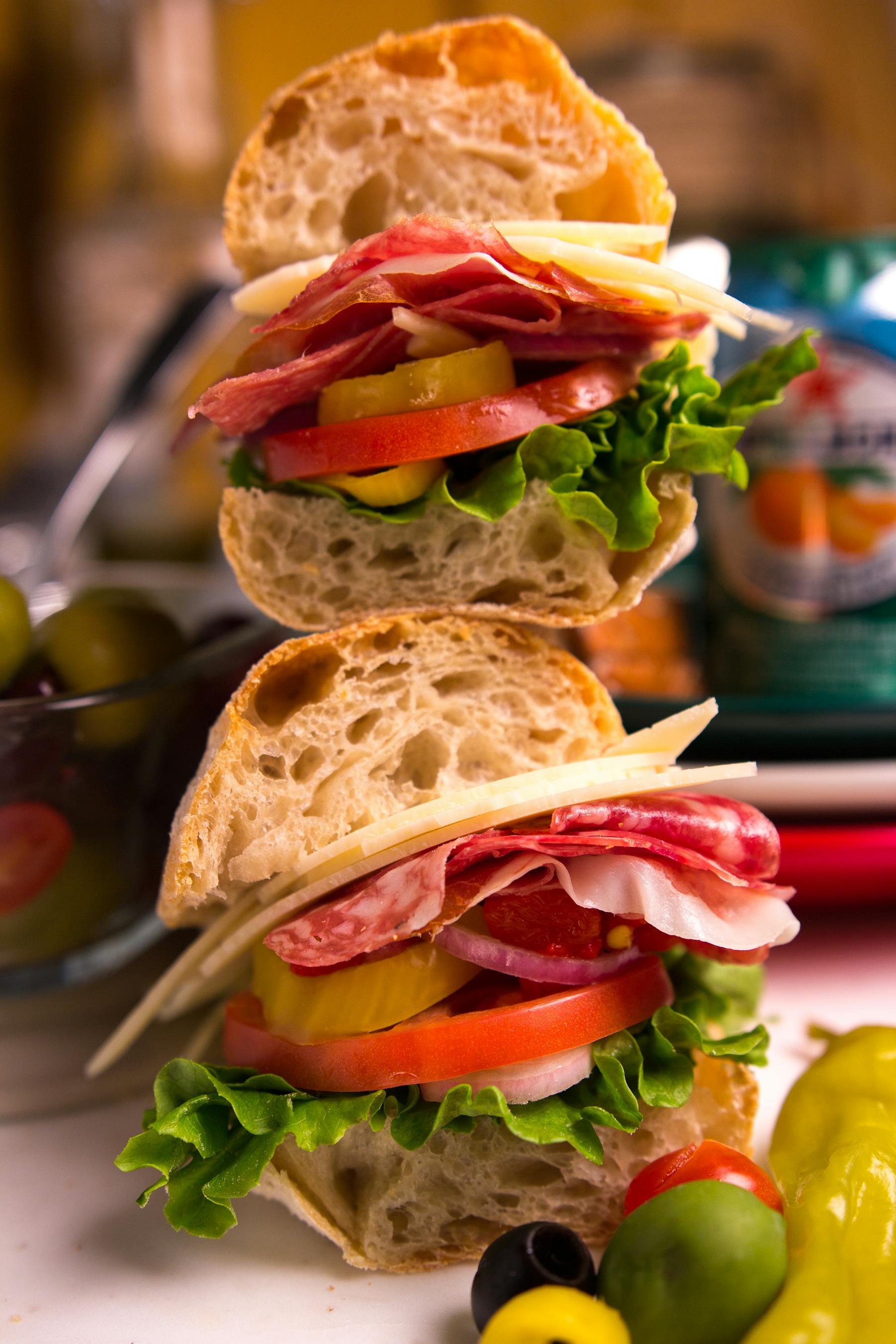 a close up of a plate of food with a sandwich and a salad