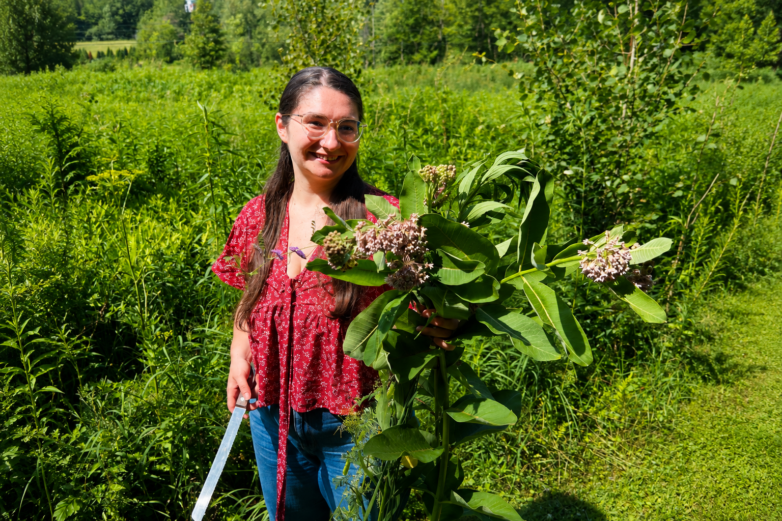 a woman holding a plant