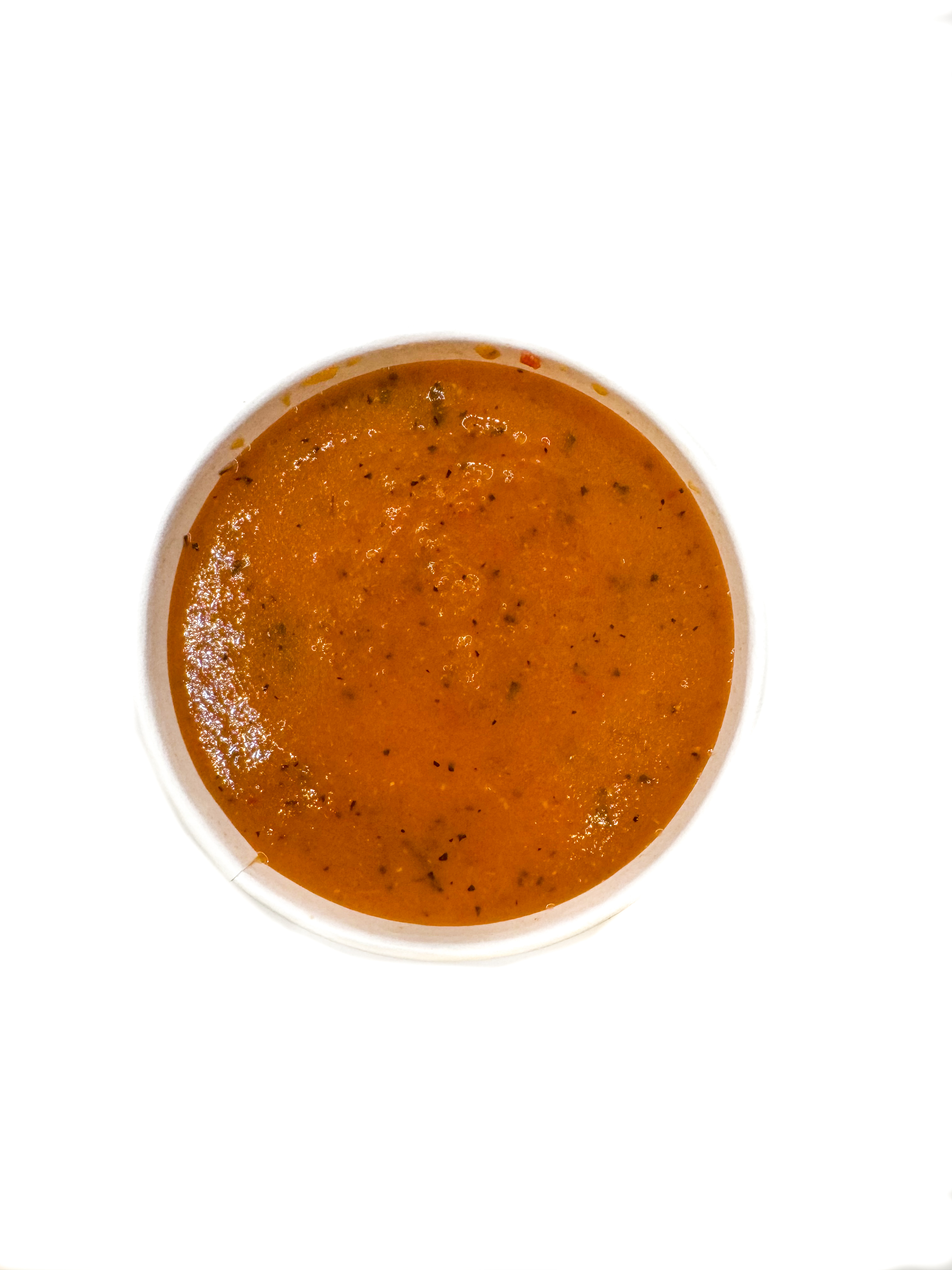 a bowl of soup on a white background