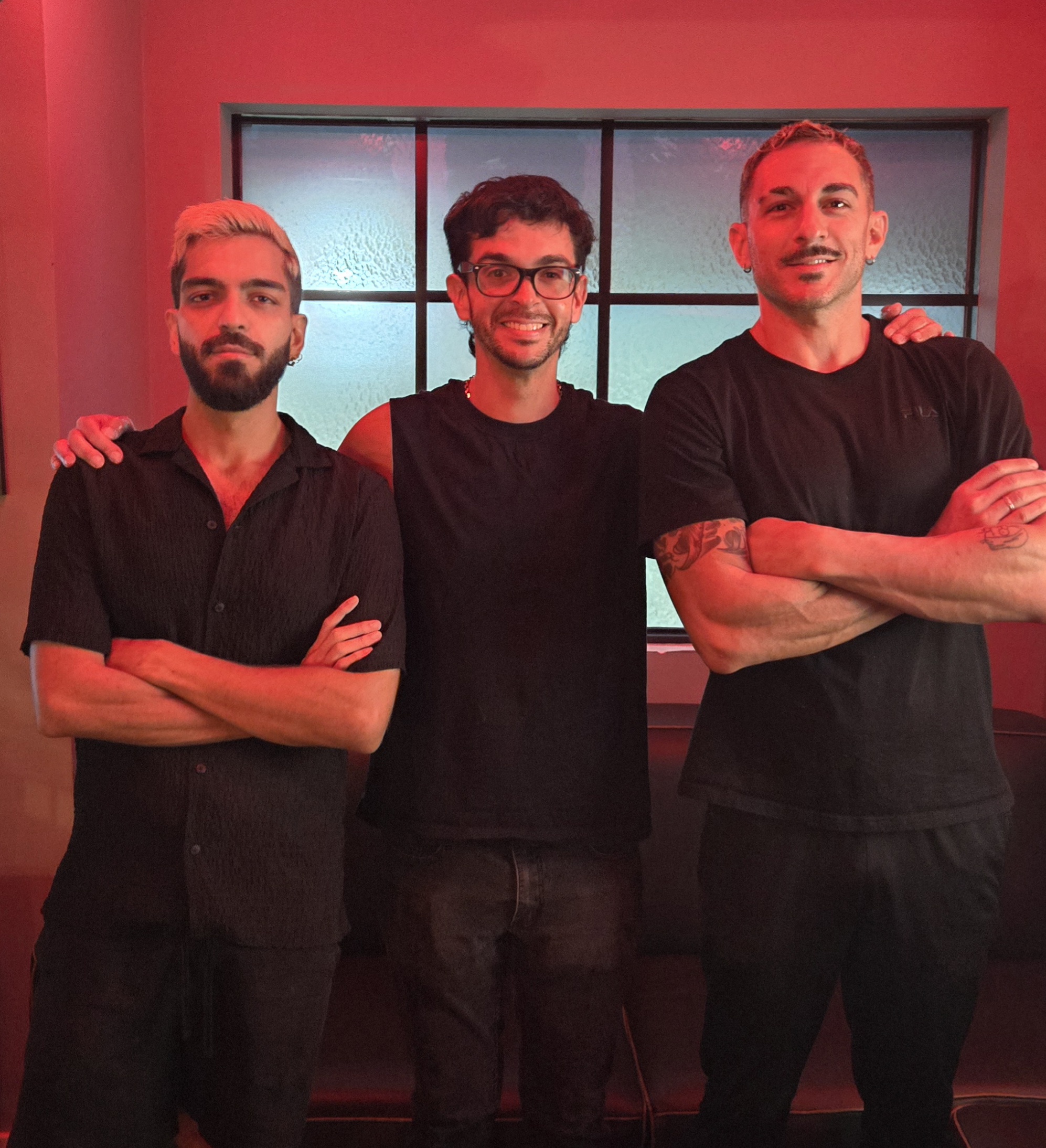 a person standing in front of a group of people posing for the camera