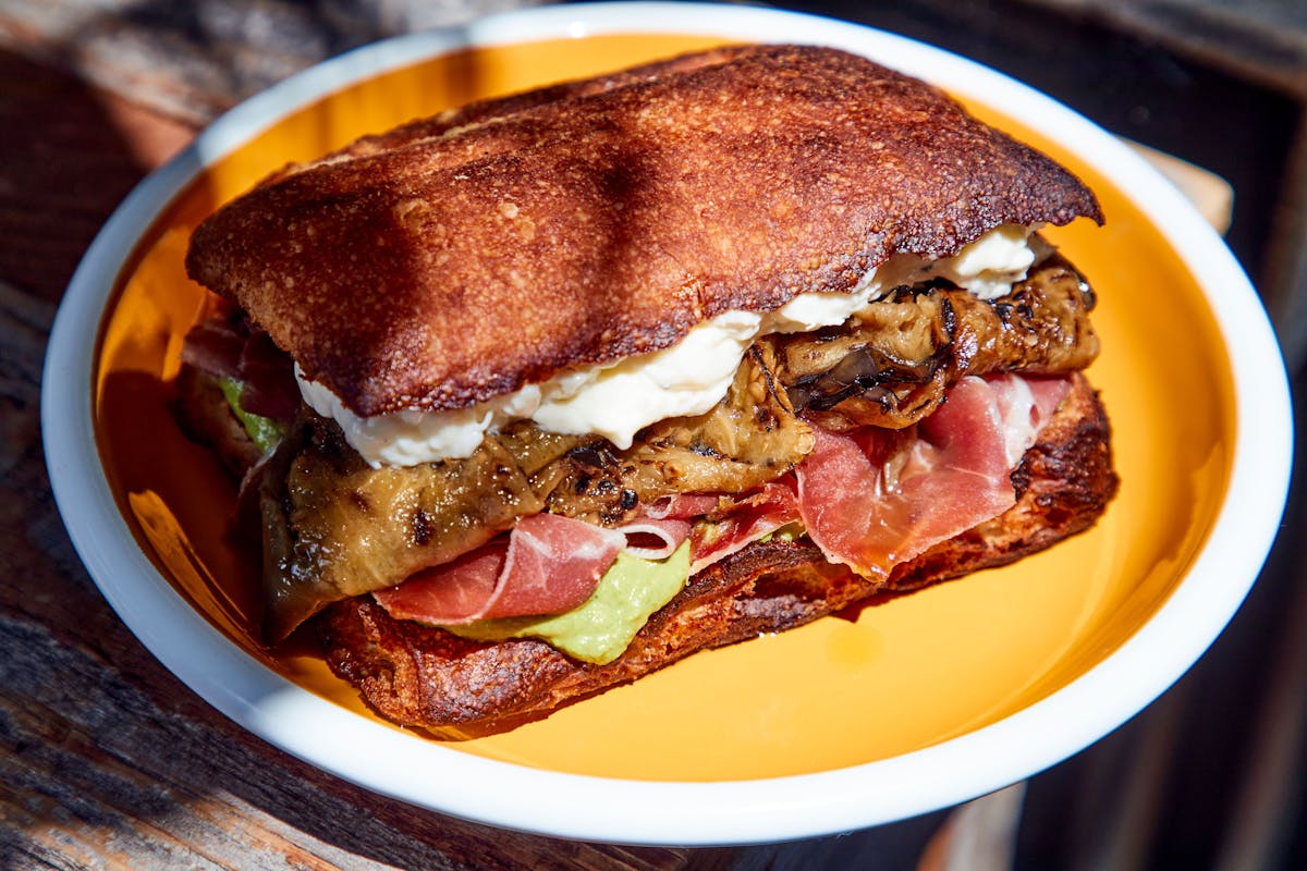 a sandwich sitting on top of a plate of food